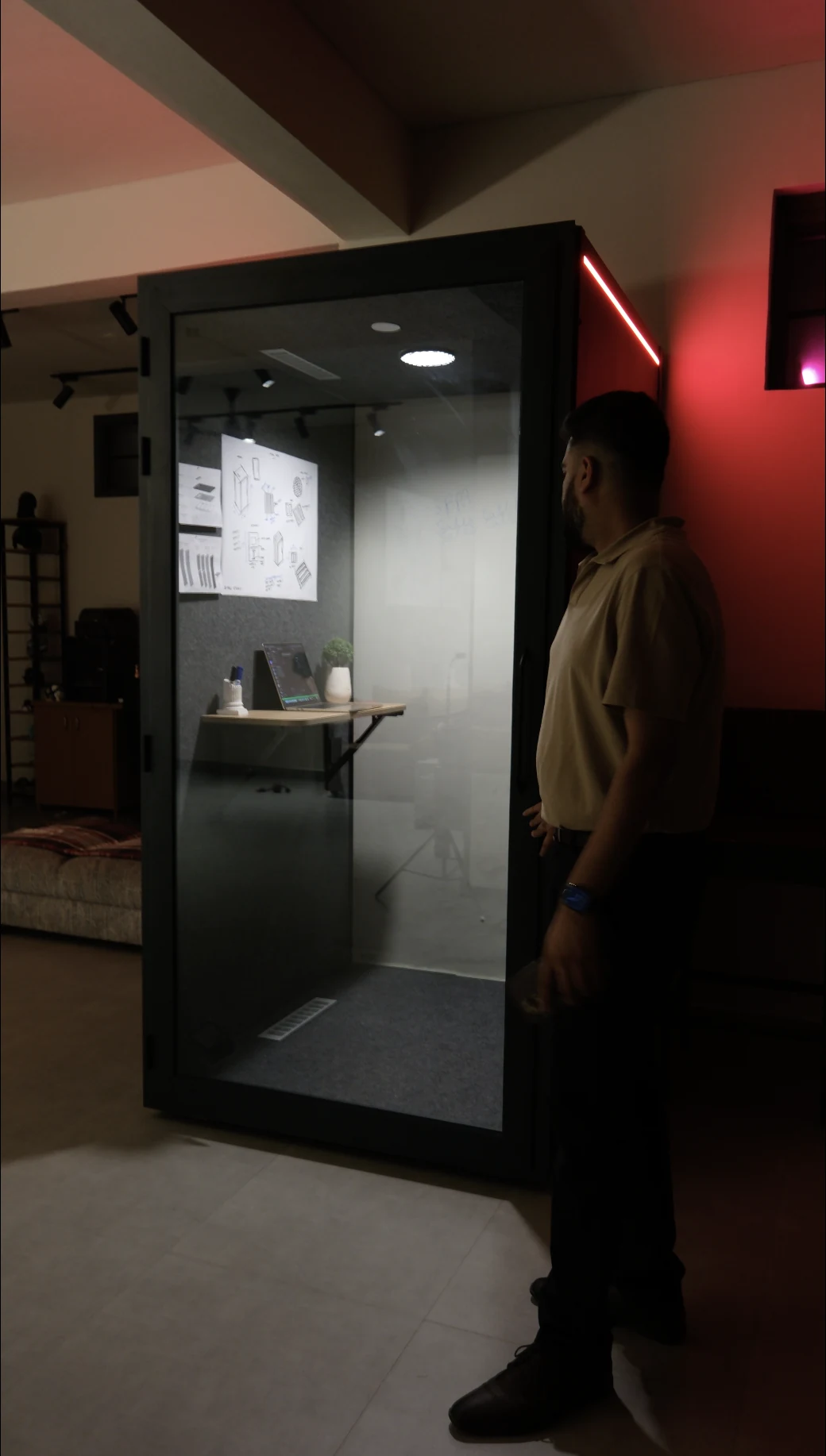 ONE POD exterior, person looking in